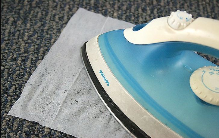 Removing stains with iron